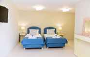 Bedroom 4 Aurora Luxury Retreat - Beachfront & Private Pool