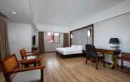 Bedroom 5 Ramada Encore by Wyndham Qionghai Downtown