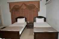 ห้องนอน Ramada Guest House