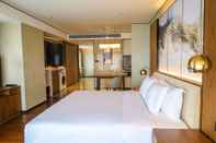 Bedroom Howard Johnson by Wyndham Optics Valley Residence Wuhan