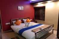 Kamar Tidur Goroomgo Hotel Sizzler Puri