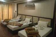 Bilik Tidur The Grand Hotel & Restaurant