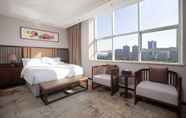 Bedroom 3 Ramada Encore by Wyndham Linqu Downtown