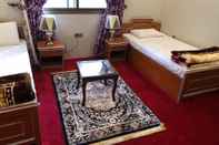 Kamar Tidur Ghizer Blossom Inn Hotel