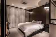 Kamar Tidur Ilsan Queen Town Hotel