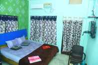 ห้องนอน Goroomgo Krishna Kunja Puri
