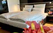 Kamar Tidur 3 The Bridgge Grand Boutique Hotel