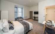 Bedroom 5 Exquisite Serviced Studio With Private Parking