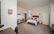 Bedroom 3 Exquisite Serviced Studio With Private Parking