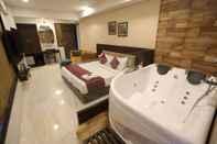 Bedroom Hotel Privya Rooms and banquet Surat