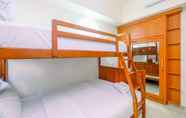 Bedroom 6 Comfort 1BR at Evenciio Margonda Apartment