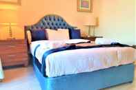 Phòng ngủ Cosy & Cute 1bedroom Dubai Tasaheel