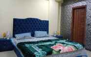 Bedroom 7 Lovely 2-bed Apartment in Rawalpindi