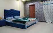 Bedroom 6 Lovely 2-bed Apartment in Rawalpindi