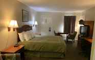 Bedroom 6 Merrimac Inn & Suites