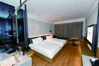 ห้องนอน Mango Crystal Hotel