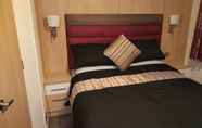 Bedroom 7 Lovely 3-bed Lodge in Towyn Near Rhyl