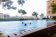 Swimming Pool Comfortable and Cozy Living 2BR at Lagoon Apartment