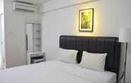 Bedroom 6 Elegant and Comfy Studio at Bassura City Apartment