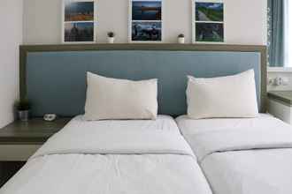 Bedroom 4 Comfort and Elegant 1BR at Gold Coast Apartment