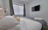 Kamar Tidur 7 Adamstown Short Stay Apartments