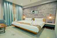 Phòng ngủ RG Exclusive Hotel-Akola