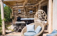 Lobi 2 Le Hameau des Pesquiers Ecolodge, Curio Collection by Hilton