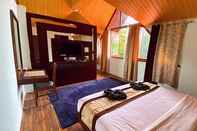Bedroom The Rumtek Cottages by ShriGo Hotels