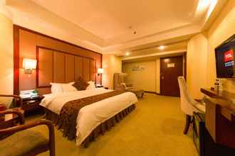 Kamar Tidur 4 Jinguan Holiday Hotel