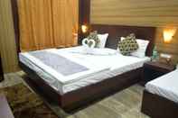 Bedroom Goroomgo Dhingra Residency Jabalpur
