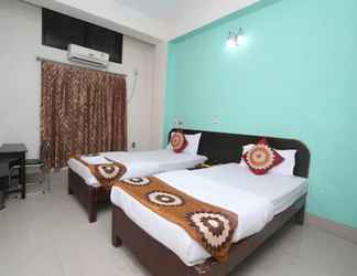 Bilik Tidur 2 Goroomgo Blue Moon Guest House Guwahati