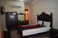 Kamar Tidur Hotel Travel Inn