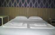 Bilik Tidur 4 Nest n Rest Hotel