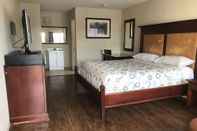 Bedroom Great Western Inn & Suites - Saginaw