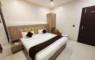 Bedroom 3 Radha Residency by ShriGo Hotels