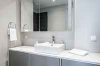 In-room Bathroom Roya Nova Residence by NewInn