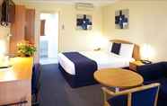 Bedroom 4 SureStay Hotel by Best Western Karinga Motel