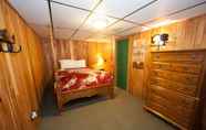 Bedroom 6 Log Cabin Lodge & Suites