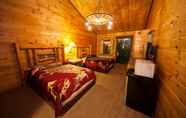 Bedroom 5 Log Cabin Lodge & Suites