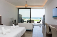 Bedroom Crete Resort Sea Side Suites - Adults only by Checkin