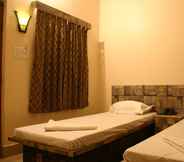 Bedroom 5 Utsav Grand by ShriGo Hotels