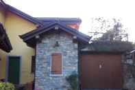 Exterior Chalet Dania With Garden Pool and View of the Lake Maggiore