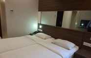 Phòng ngủ 3 Hotel Palmyra Grand Inn