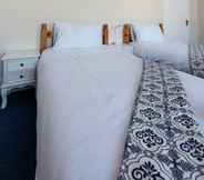 Kamar Tidur 7 Newton Guesthouse