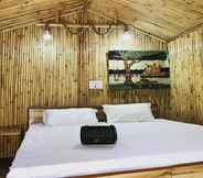 Bilik Tidur 4 Tirthan Village Huts