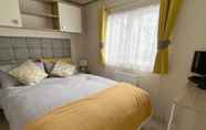 Bedroom 6 Impeccable 3-bed Cabin in Tattershall, UK