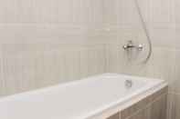 In-room Bathroom Cozy And Elegant 1Br Vasanta Innopark Apartment