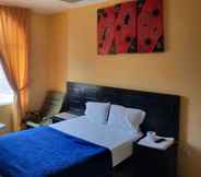 Phòng ngủ 2 Hotel Loma Dorada