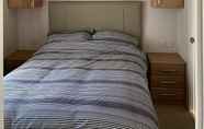 Bedroom 5 Immaculate 2-bed Lodge in Monreith