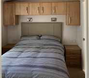 Bedroom 5 Immaculate 2-bed Lodge in Monreith